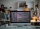 Workplace of it-developer or programmer with computer screen with coded data on background of office workers